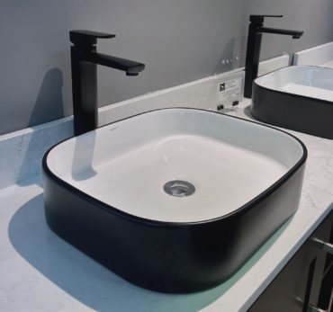 square basin with black surface basin