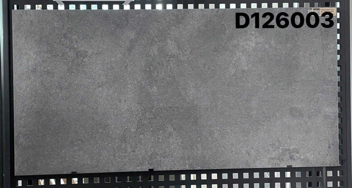 1200-Tile-D126003-scaled-1.jpg Gray tile sample labeled D126003 on display.