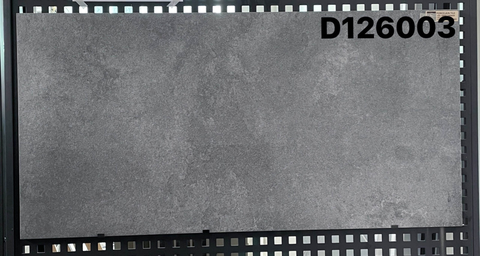 Gray tile sample labeled D126003 on display.
