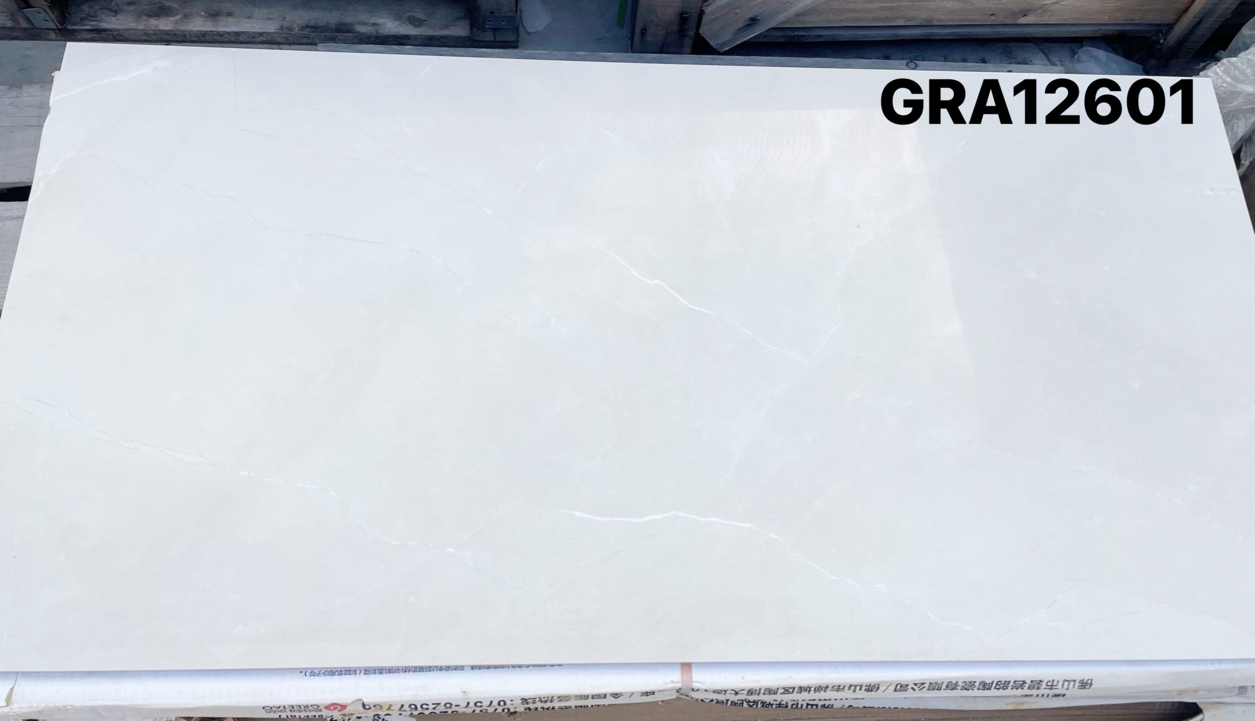 White tile with subtle veining, labeled GRA12601.