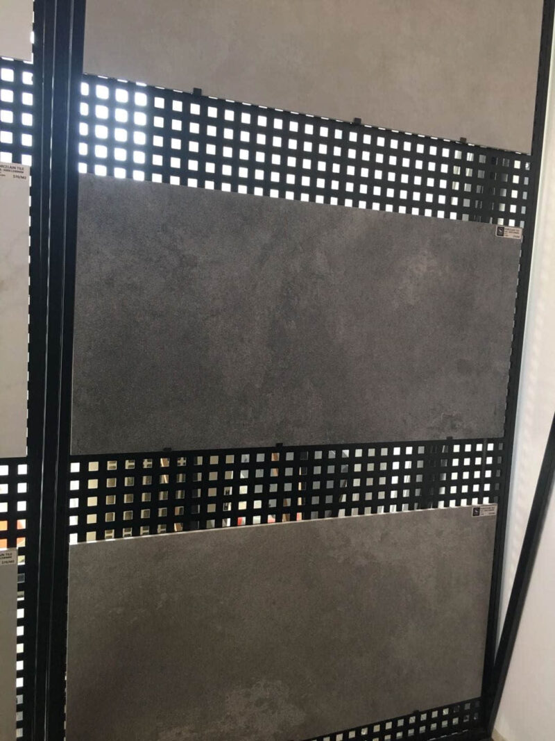 Gray stone tiles displayed on a black grid panel.