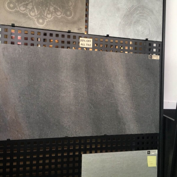 Display of various tiles with a 20% off sign.