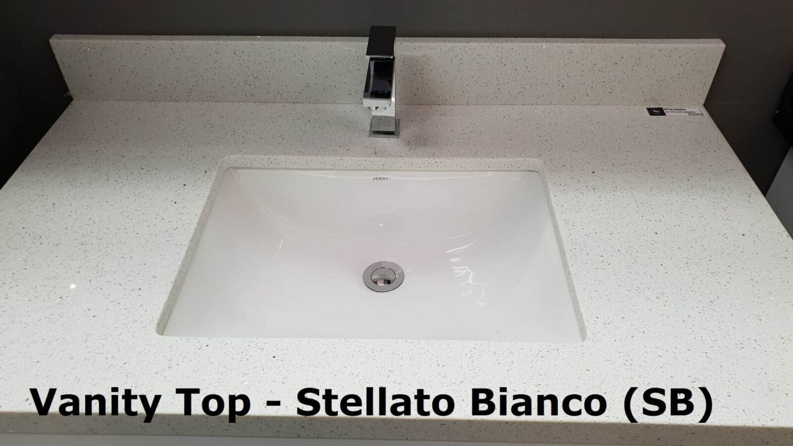 Vanity top with Stellato Bianco finish and modern faucet.