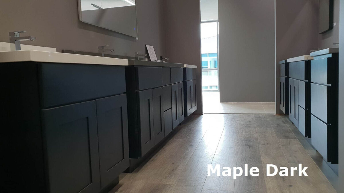 Dark maple kitchen cabinets with modern sinks and mirrors.
