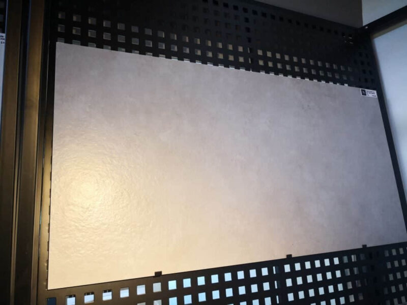 Textured wall panel with decorative grid design.