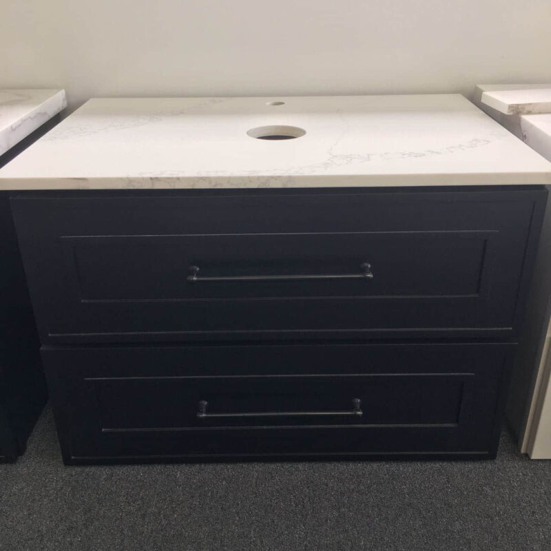 Black bathroom vanity with white countertop and two drawers.