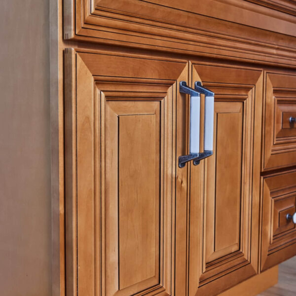 Wooden kitchen cabinet with detailed paneling and modern handles.