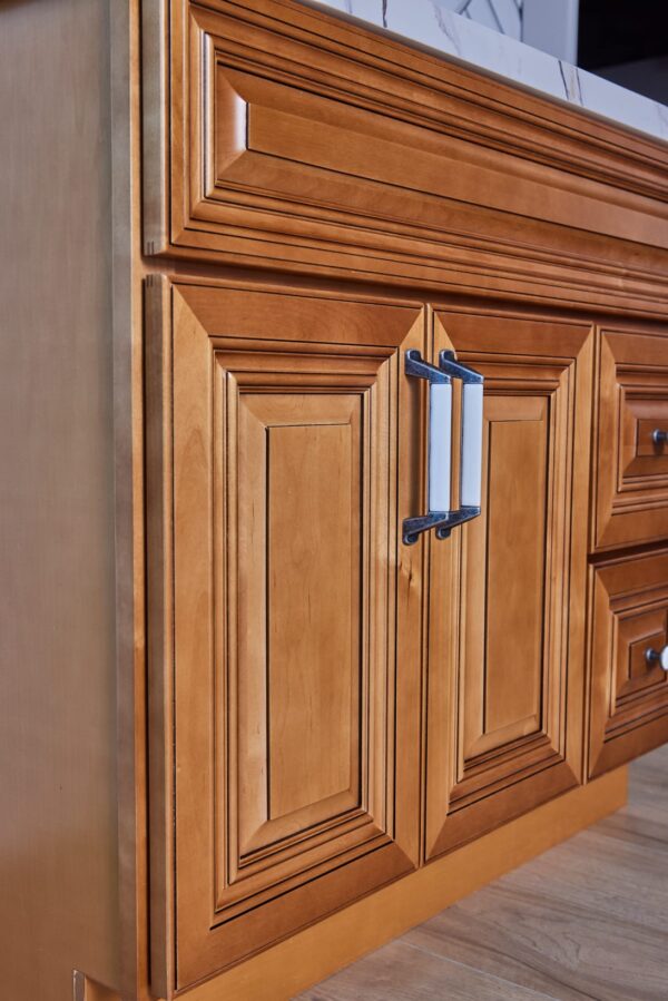 Wooden kitchen cabinet with detailed paneling and modern handles.