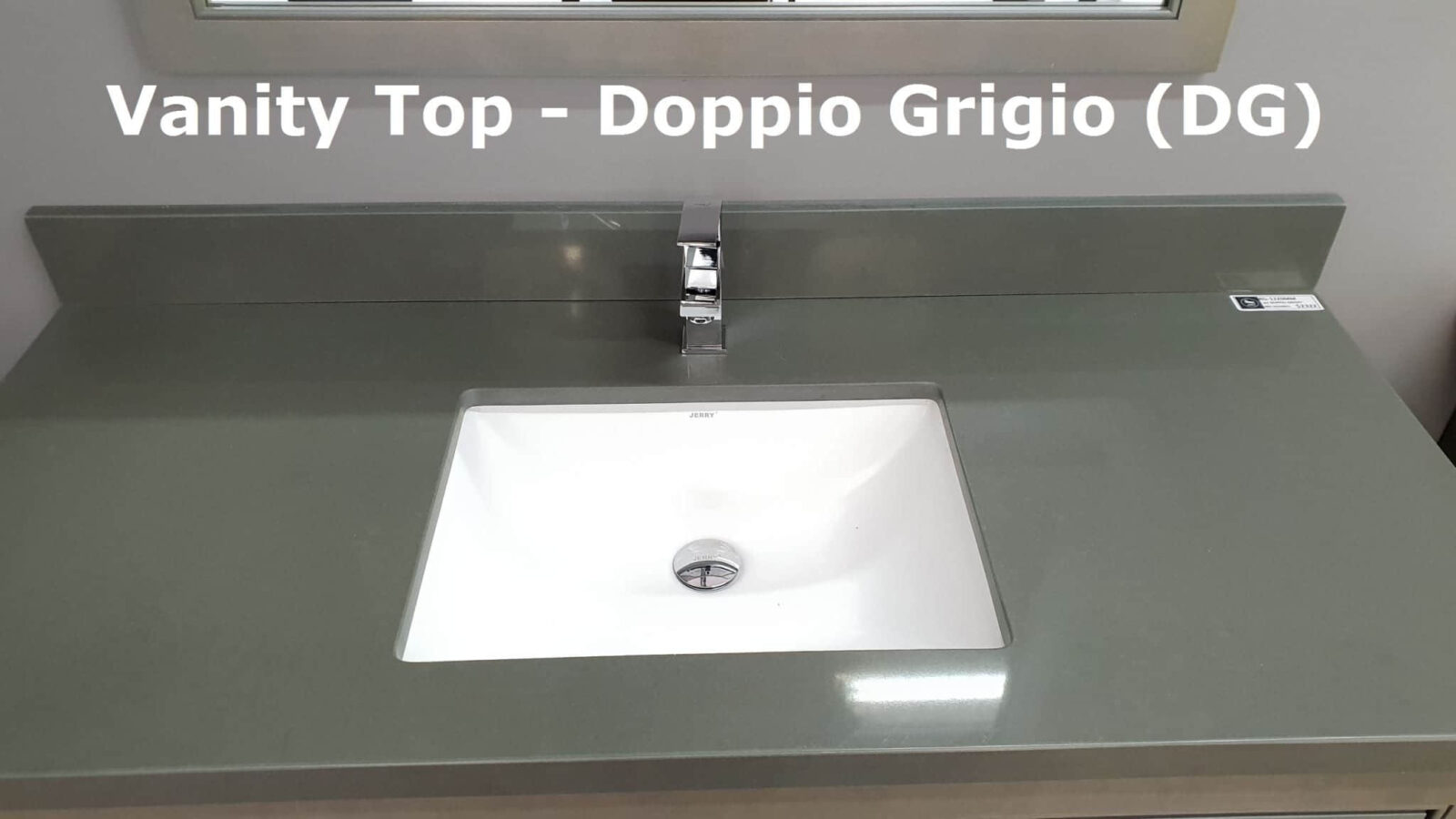 Gray countertop with sink and faucet, labeled "Doppio Grigio."