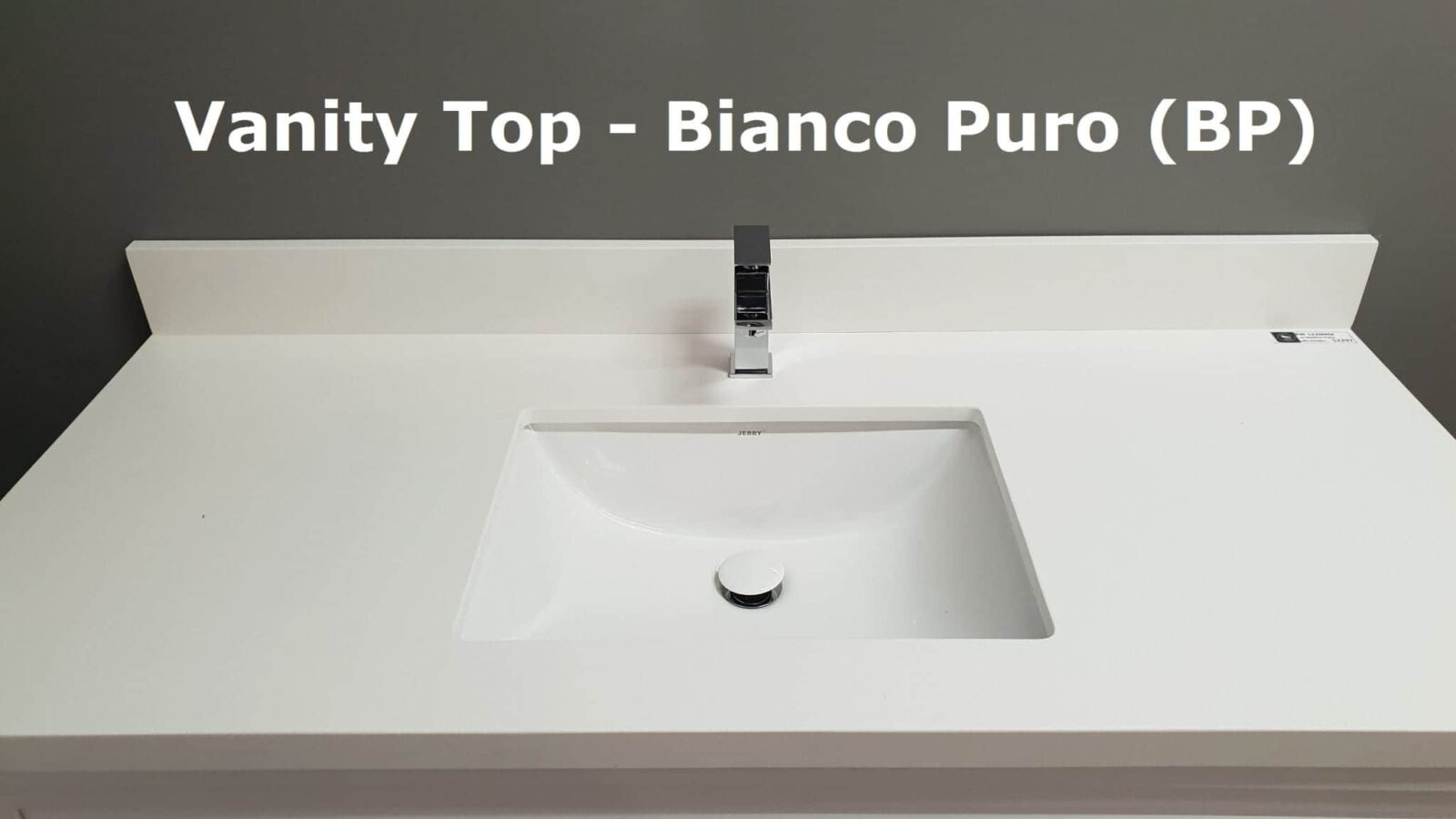 White vanity top with integrated sink and modern faucet.