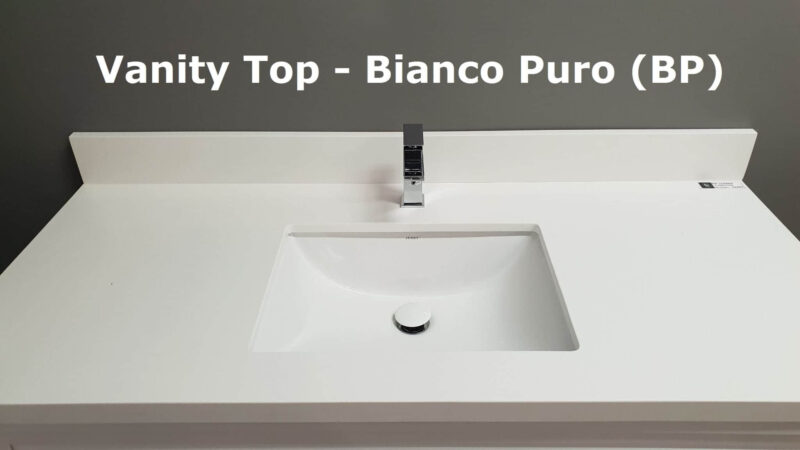 White vanity top with integrated sink and modern faucet.