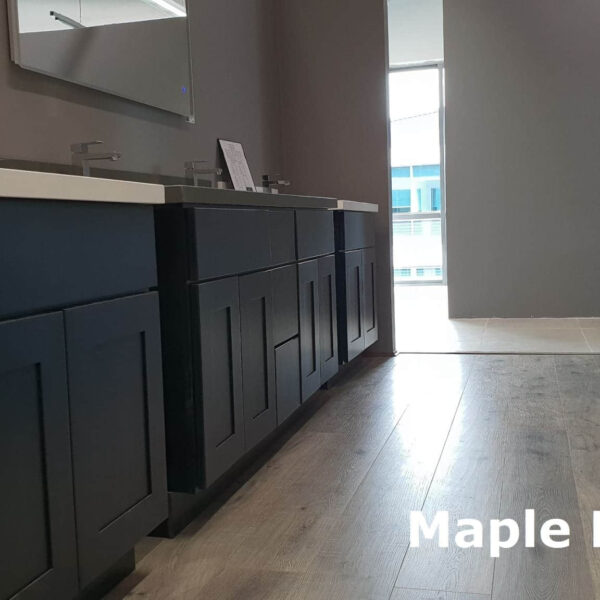 Dark maple kitchen cabinets with modern design and sleek countertops.