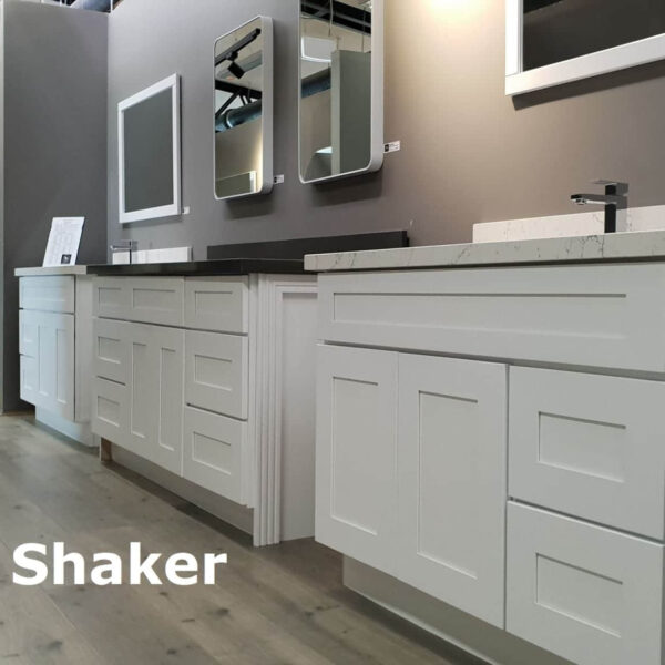 White shaker-style kitchen cabinets with mirrors above.