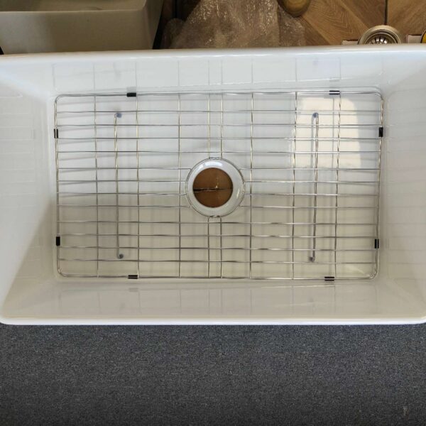 Butler sink protector in a white sink.