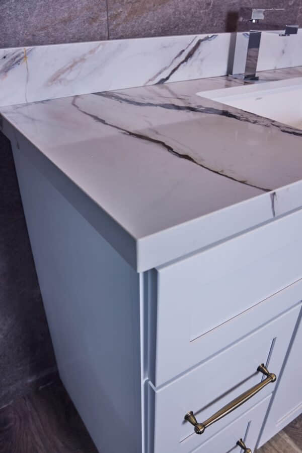 Marble countertop with sink in modern kitchen design.