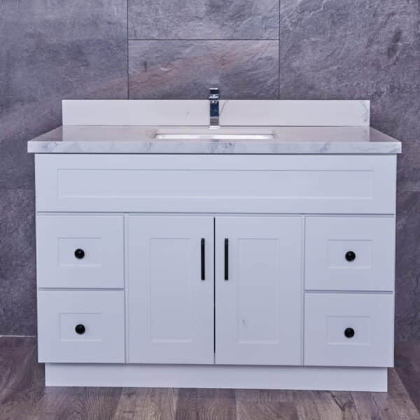 WS-3V4720D-1.jpg White bathroom vanity with marble countertop and sink.