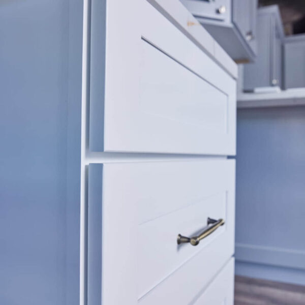 White kitchen cabinet with silver handle in modern kitchen.