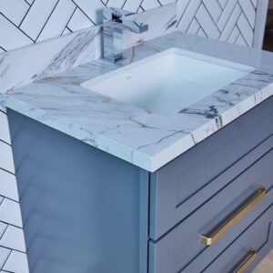 Blue bathroom vanity with marble countertop and modern faucet.
