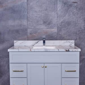 Modern bathroom vanity with marble countertop and gray cabinets.