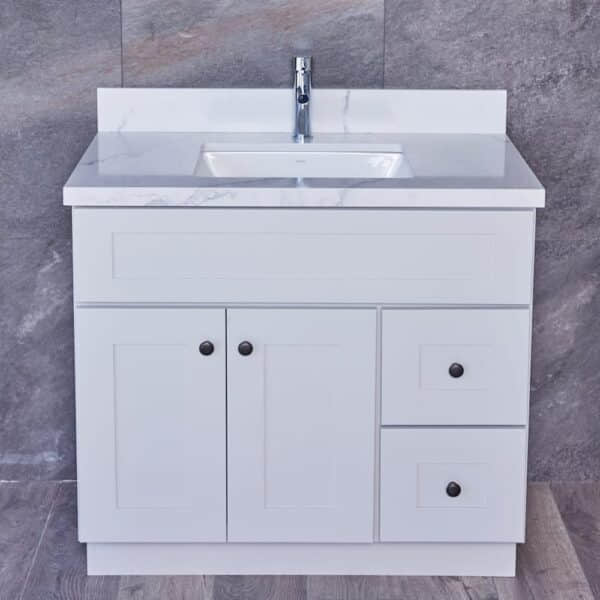 WSLG-3V3620DR-1-1.jpg White bathroom vanity with marble countertop and chrome faucet.