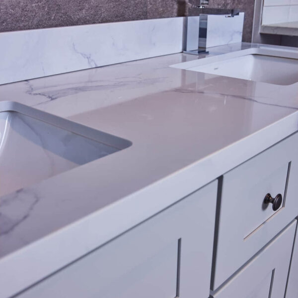 Modern kitchen countertop with marble finish and integrated sink.