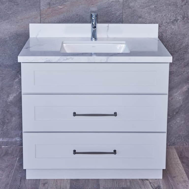 White bathroom vanity with marble countertop and two drawers.