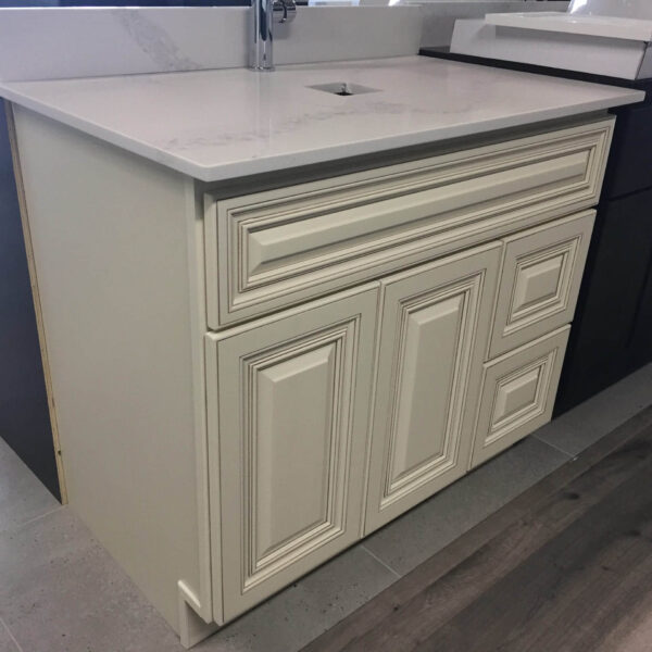 Matt black pop-up waste with overflow, 32mm, on carpeted surface.