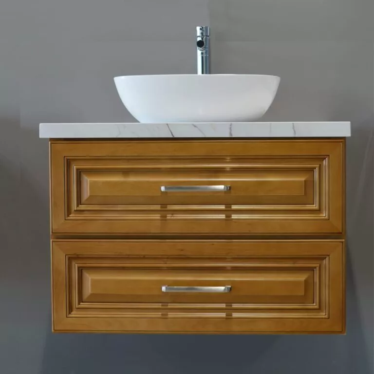 Wooden wall-mounted vanity with white sink and chrome faucet.