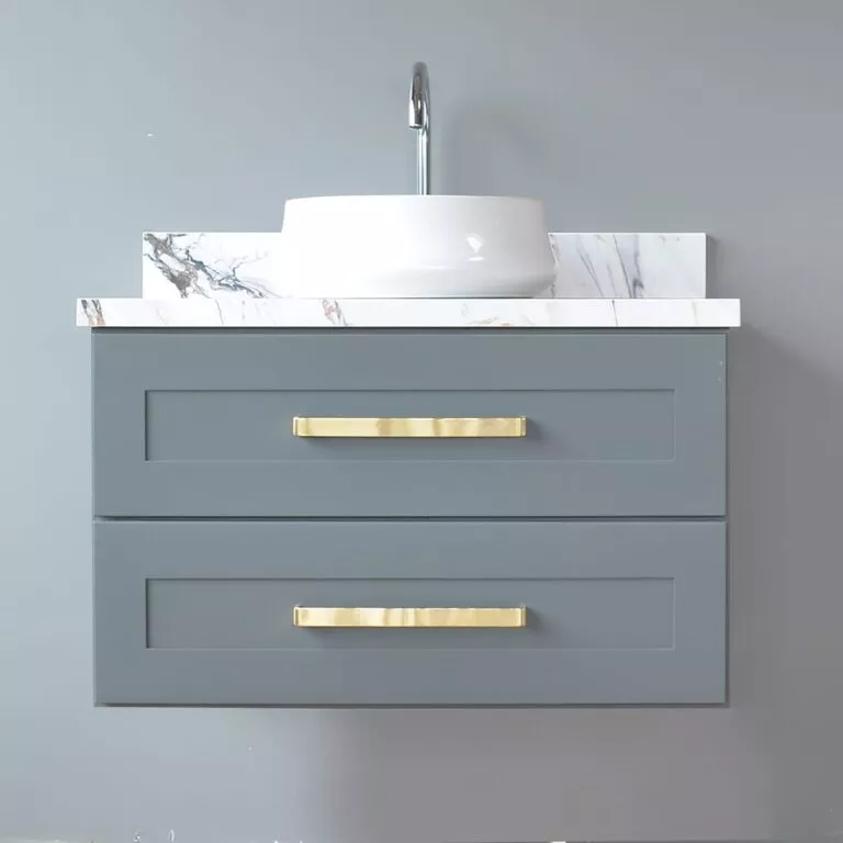 Wall-mounted grey vanity unit with gold handles, marble countertop, and white above-counter basin