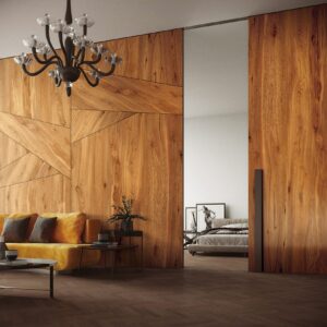 Modern living room with wooden walls and chandelier.