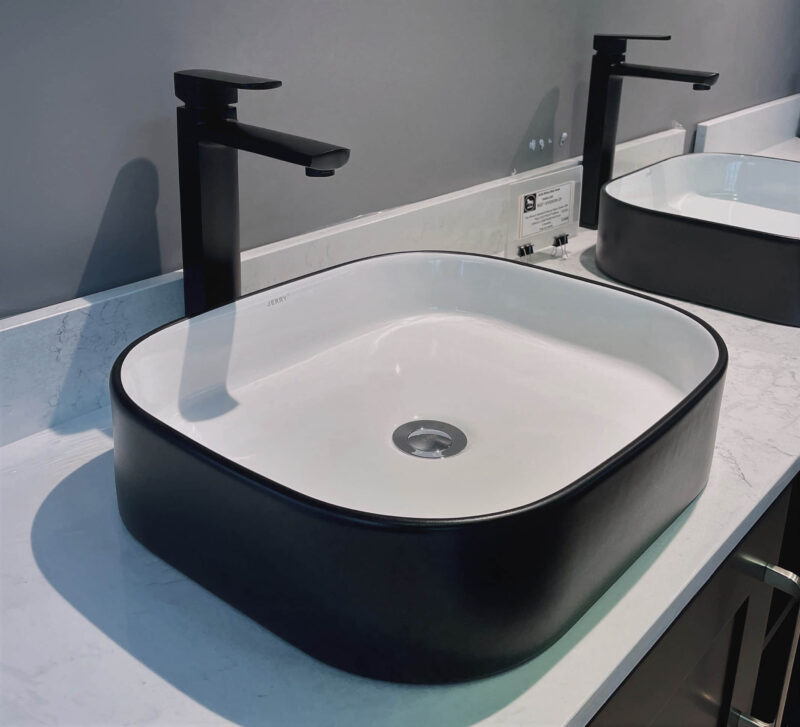square basin with black surface basin
