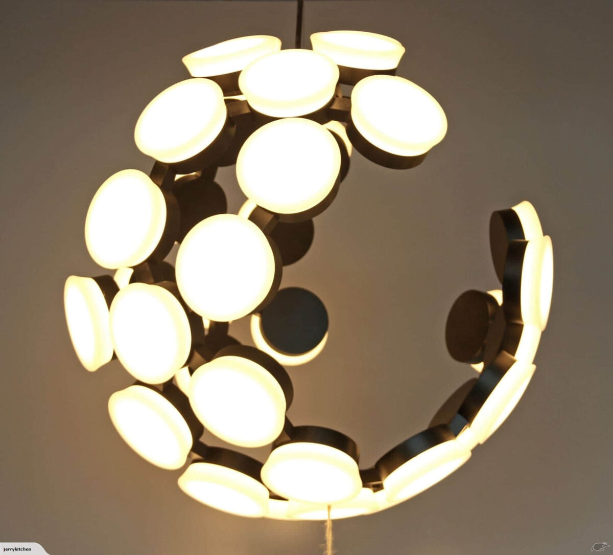 9066-a 1l Modern circular chandelier with glowing white lights.