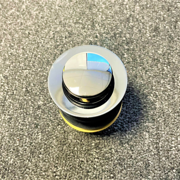 Chrome 32mm pop-up waste without overflow on textured surface.