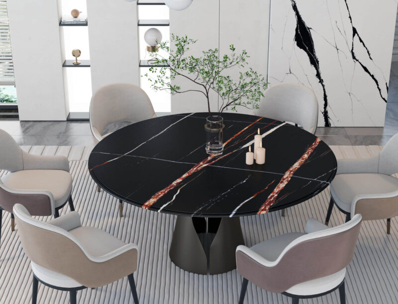Modern dining room with a round black marble table and six chairs.