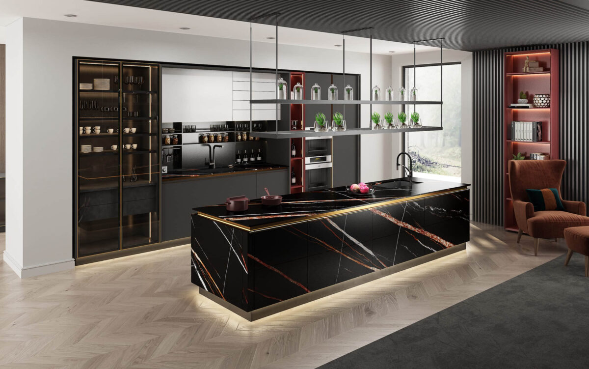 Modern kitchen with black and gold marble island, open shelving, and elegant decor.