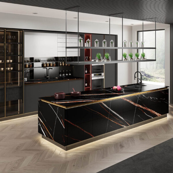 Modern kitchen with black and gold marble island, open shelving, and elegant decor.