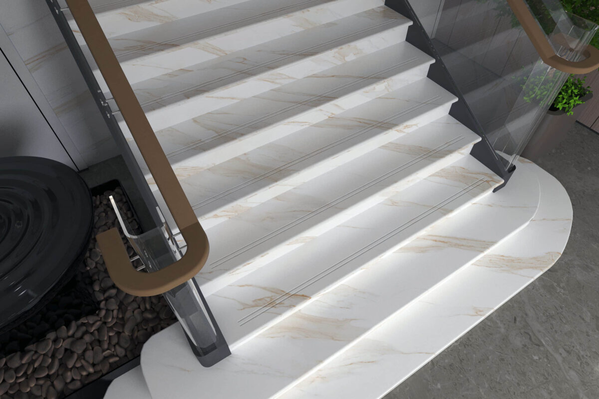 Marble staircase with glass railings and wooden handrails.