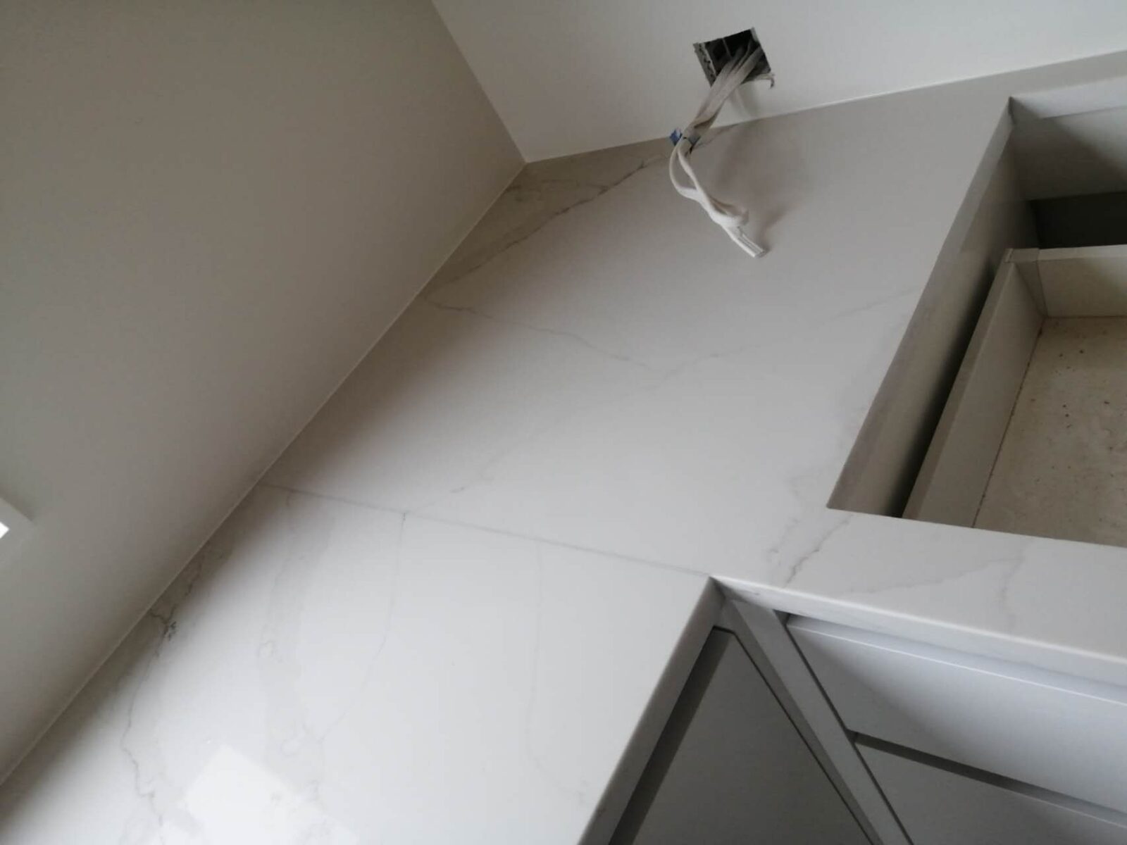 Calacatta Belleza countertop installation in modern kitchen.