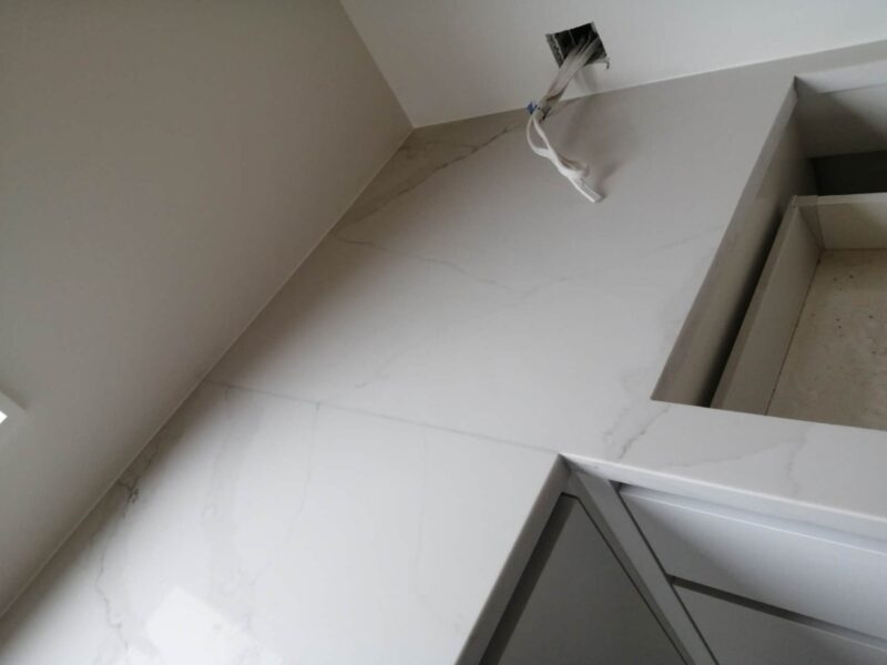 Calacatta Belleza countertop installation in modern kitchen.