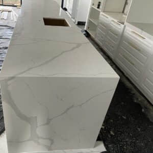 Calacatta Sky Quartz countertop in modern kitchen setting.