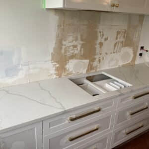 Calacatta Sky Quartz countertop installation in progress in a kitchen.