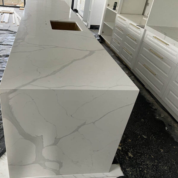 Calacatta Sky Quartz countertop in modern kitchen setting.