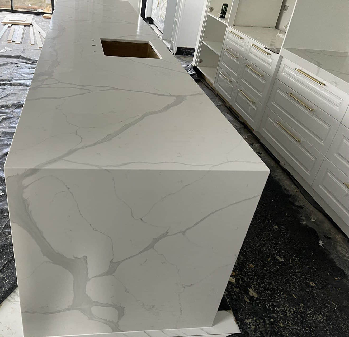 Calacatta Sky Quartz countertop in modern kitchen setting.