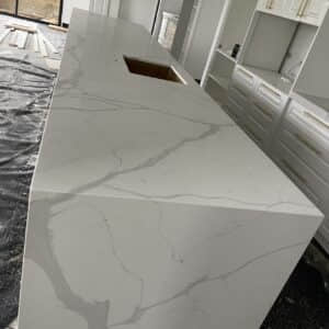 Calacatta Sky Quartz kitchen countertop installation in progress.