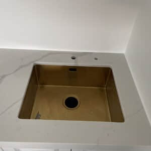 Calacatta Sky Quartz countertop with a square sink.