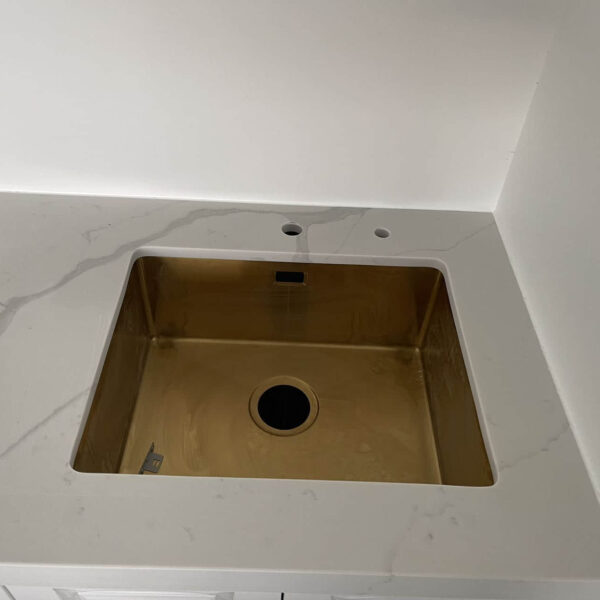 Calacatta Sky Quartz countertop with a square sink.