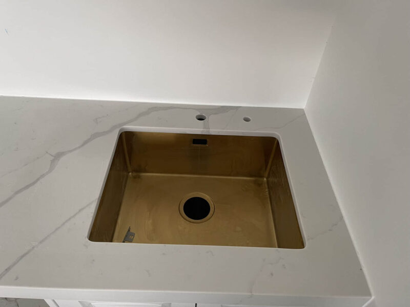 Calacatta Sky Quartz countertop with a square sink.