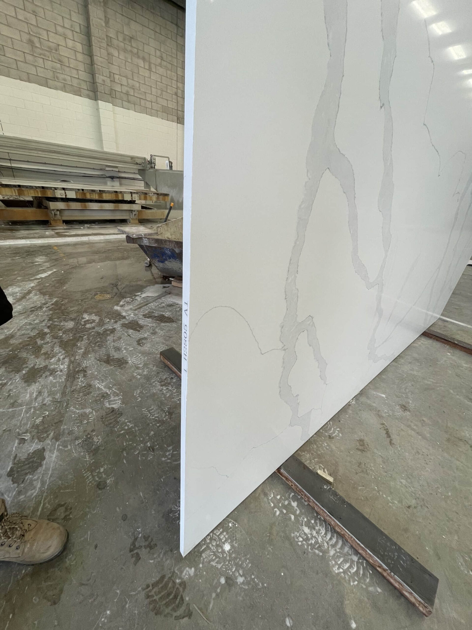 Marble slab in a warehouse, side view.