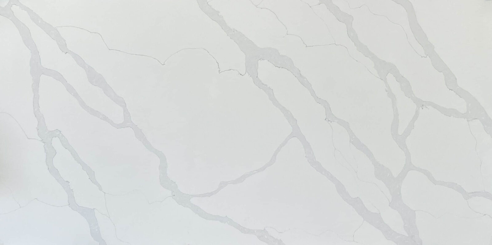 White marble countertop with subtle gray veining.