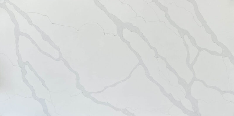 White marble countertop with subtle gray veining.